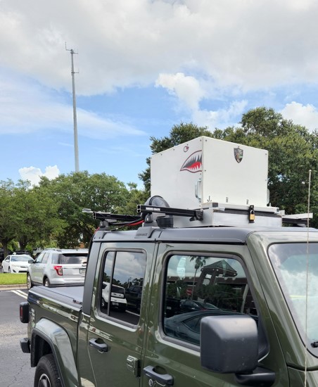 Vehicle testbed equipped with sensors, cameras, and electronics for data collection and experimentation.